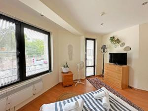 a bedroom with a bed and a large window at Beachside Bliss by Mery -Balchik in Balchik