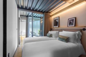 Llit o llits en una habitació de Feel Porto Matosinhos City Flats