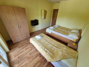 Postel nebo postele na pokoji v ubytování Vila MINJA