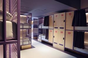 a locker room with bunk beds and lockers at Bunks at Rode in Oslo