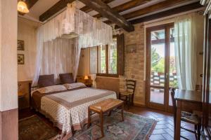 Postel nebo postele na pokoji v ubytování Agriturismo Ai Vigneti