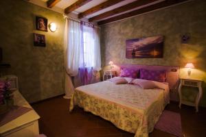 Postel nebo postele na pokoji v ubytování Agriturismo Ai Vigneti