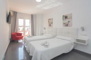 Postel nebo postele na pokoji v ubytování Hostal La Ermita