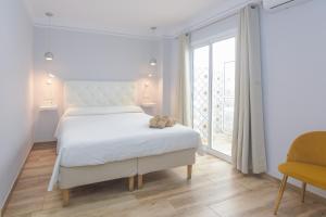 Postel nebo postele na pokoji v ubytování Hostal La Ermita