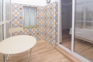 Postel nebo postele na pokoji v ubytování Hostal La Ermita