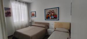 A bed or beds in a room at Il Centro Apartments