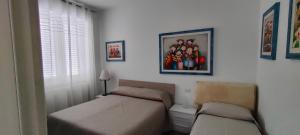 A bed or beds in a room at Il Centro Apartments