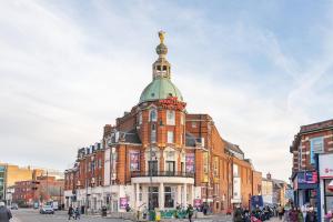 a building with a green dome on top of it at Veeve - Village Beauty in London
