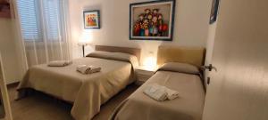 A bed or beds in a room at Il Centro Apartments