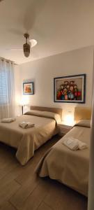 A bed or beds in a room at Il Centro Apartments