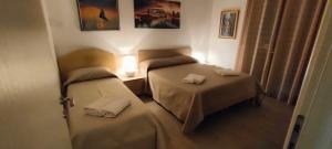 A bed or beds in a room at Il Centro Apartments