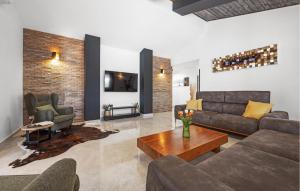 a living room with a couch and a table at 4 Bedroom Lovely Home In Labin in Labin