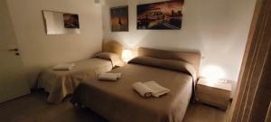 A bed or beds in a room at Il Centro Apartments