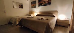 A bed or beds in a room at Il Centro Apartments
