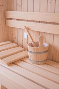 a wooden bucket in a sauna at CALEA Boutique Hotel in Bacoli