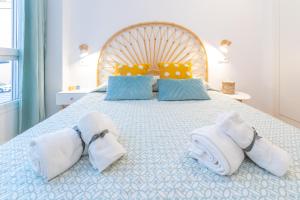 Ένα ή περισσότερα κρεβάτια σε δωμάτιο στο Acogedor apartamento junto al mar