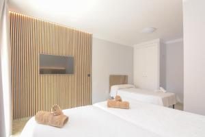 Postel nebo postele na pokoji v ubytování Hostal La Ermita