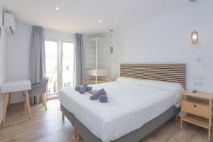 Postel nebo postele na pokoji v ubytování Hostal La Ermita