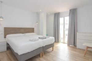 Postel nebo postele na pokoji v ubytování Hostal La Ermita