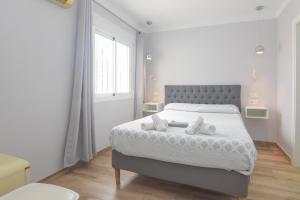 Postel nebo postele na pokoji v ubytování Hostal La Ermita