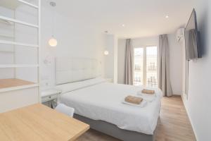 Postel nebo postele na pokoji v ubytování Hostal La Ermita