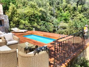 a small swimming pool on a deck with a fence at Mas des Arts & Spa in La Colle-sur-Loup