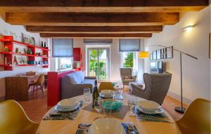 a dining room and living room with a table and chairs at 2 Bedroom Gorgeous Home In Cartoceto in Cartoceto