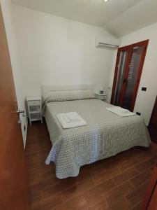 Postel nebo postele na pokoji v ubytování Casa di Lu’