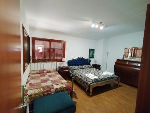 Postel nebo postele na pokoji v ubytování Casa di Lu’