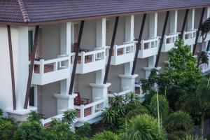 anterior view of a building with white balconies at Neptune's Villa in Haad Rin
