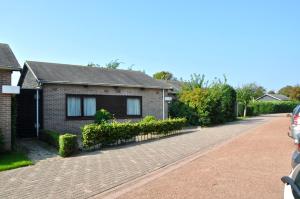 a brick house on a brick road at Boerenslag 46 in Sint Maartenszee