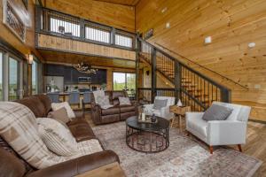 a living room with a couch and a table at Peace Giver by Eden Crest in Gatlinburg
