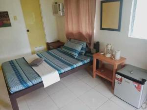 Postel nebo postele na pokoji v ubytování Malapascua Hideaway Resort