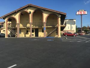 an empty parking lot in front of a building at Sierra Inn in South El Monte