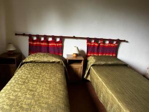 Letto o letti in una camera di Agriturismo Poggialberi