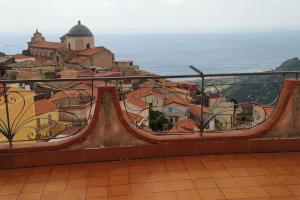 a view of a city from a balcony at casa la terrazza sul mare in Alì