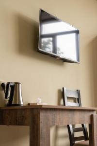 TV a/nebo společenská místnost v ubytování Glendale Boutique Hotel