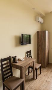 TV a/nebo společenská místnost v ubytování Glendale Boutique Hotel