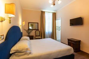Postel nebo postele na pokoji v ubytování Boutique Hotel Heritage