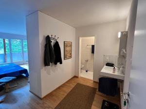 a room with a bathroom with a toilet and a sink at Obm See in Davos Wolfgang