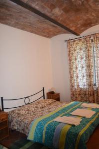 Letto o letti in una camera di Agriturismo Poggialberi