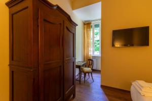 TV a/nebo společenská místnost v ubytování Boutique Hotel Heritage