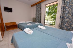 Aristotelis Hotel客房内的一张或多张床位