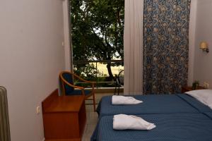 Aristotelis Hotel客房内的一张或多张床位