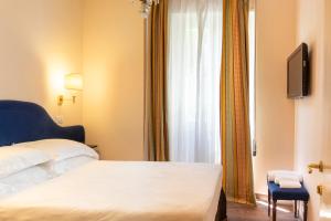 Postel nebo postele na pokoji v ubytování Boutique Hotel Heritage
