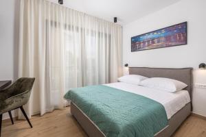 Postel nebo postele na pokoji v ubytování Apartmani Vila Mara M 1 heated pool + 27 fotografií