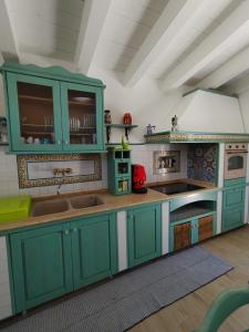Kuchyň nebo kuchyňský kout v ubytování Casa di Lu’