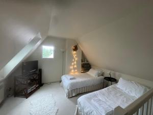 Ένα ή περισσότερα κρεβάτια σε δωμάτιο στο Duplex très proche de Deauville Tennis et piscine +8 φωτογραφίες