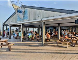 a building with benches and people sitting at tables at Myrtle Beach Resort- Unit A 428 in Myrtle Beach