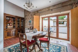 a dining room with a table and two chairs at Casa do Alambique - Douro in Armamar